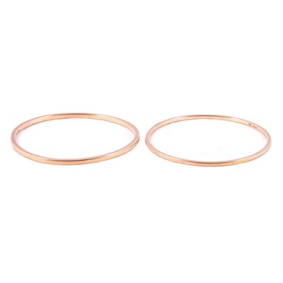 Lot 191 - Two 9 carat yellow gold solid plain bangles.
