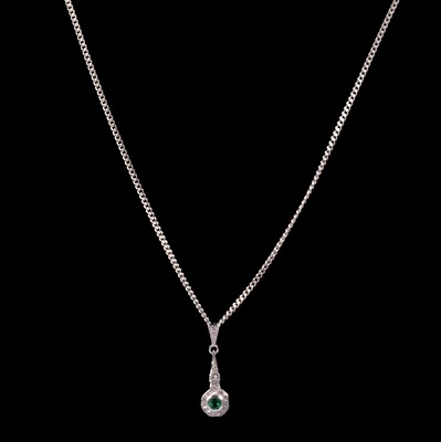 Lot 267 - An emerald and diamond pendant and chain.