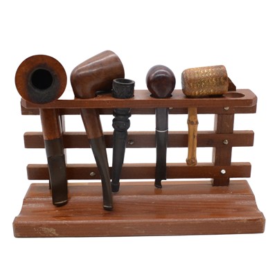 Lot 150A - Medieval nails; clay pipes; and wooden pipes on pipe stand.