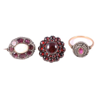 Lot 178 - A ruby and diamond chip ring, opal and pink stone brooch and red stone target brooch.