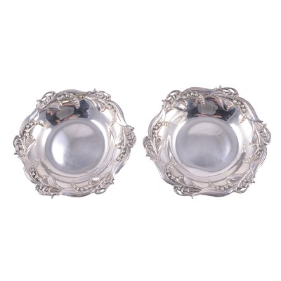 Lot 233 - Tiffany & Co - a pair of Sterling Silver lily of the valley dishes.