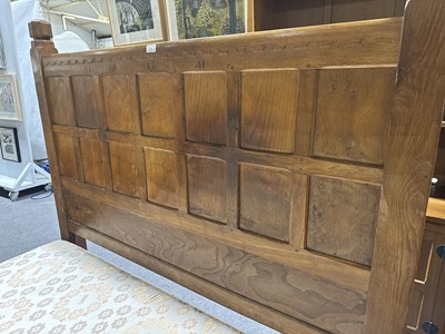 Lot 84 - Robert 'Mouseman' Thompson of Kilburn, an oak panelled double bed, dated 1941