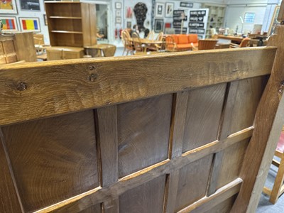 Lot 84 - Robert 'Mouseman' Thompson of Kilburn, an oak panelled double bed, dated 1941