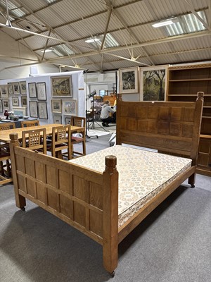 Lot 84 - Robert 'Mouseman' Thompson of Kilburn, an oak panelled double bed, dated 1941