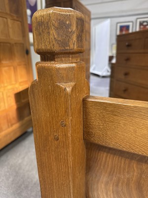 Lot 84 - Robert 'Mouseman' Thompson of Kilburn, an oak panelled double bed, dated 1941