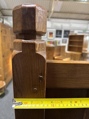 Lot 84 - Robert 'Mouseman' Thompson of Kilburn, an oak panelled double bed, dated 1941