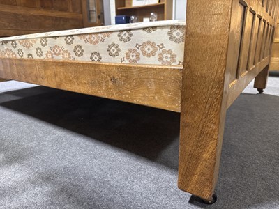 Lot 84 - Robert 'Mouseman' Thompson of Kilburn, an oak panelled double bed, dated 1941