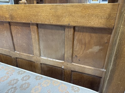Lot 84 - Robert 'Mouseman' Thompson of Kilburn, an oak panelled double bed, dated 1941