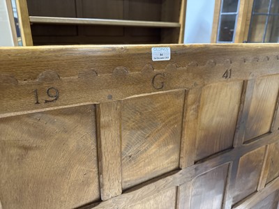 Lot 84 - Robert 'Mouseman' Thompson of Kilburn, an oak panelled double bed, dated 1941