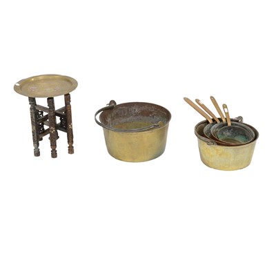 Lot 203 - Set of four copper saucepans, two brass jam pans, and an Indian folding table.