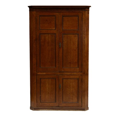 Lot 474 - Late Georgian oak freestanding corner cupboard