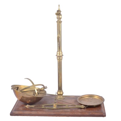 Lot 168 - A collection of brass weights and scales, small boxed set of scales.