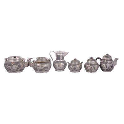 Lot 196 - Small collection of Chinese black glazed stoneware tea ware, white metal overlaid.