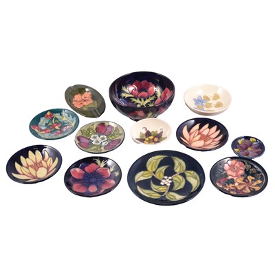 Lot 35 - Moorcroft Pottery, a collection of coasters, dishes, and bowls