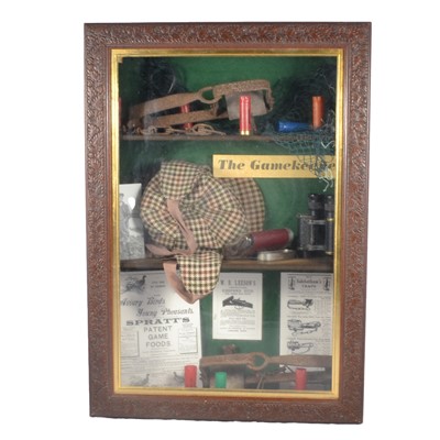 Lot 206 - A display of game keepers paraphernalia, in wooden display cabinet