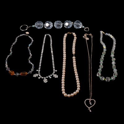 Lot 519 - A collection of costume jewellery necklaces and pendants on chains.