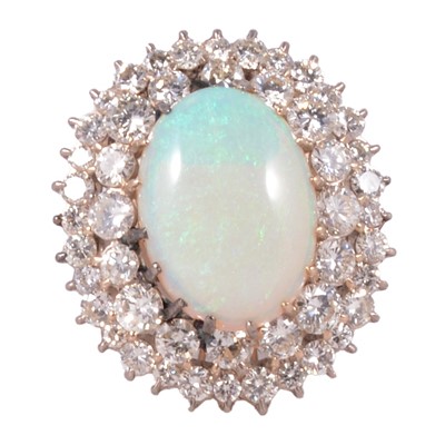 Lot 23 - An opal and diamond cluster ring.