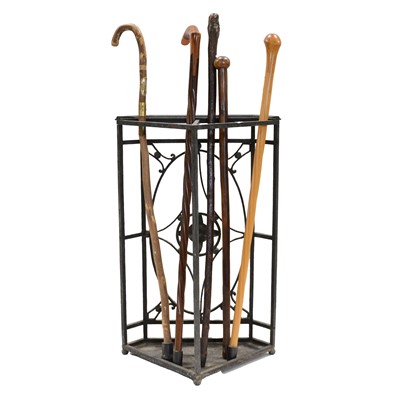 Lot 480 - Five walking sticks and an iron corner stick stand