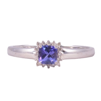 Lot 19 - A tanzanite and diamond square cluster ring.
