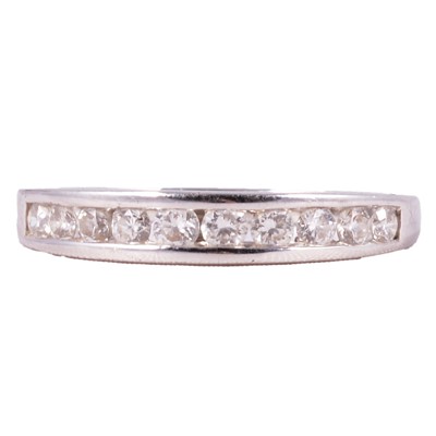 Lot 94 - A diamond half eternity ring.
