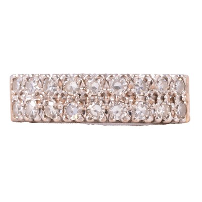 Lot 91 - A diamond two row half hoop ring.