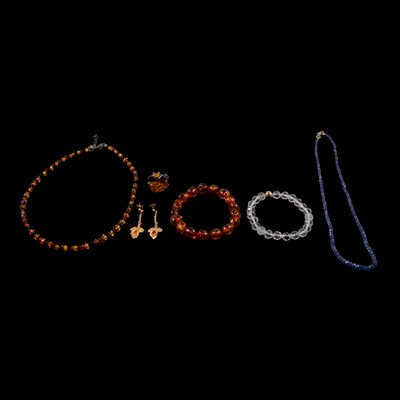 Lot 336 - Amber jewellery, sapphire bead necklace, rock crystal bracelet, and yellow metal earrings.