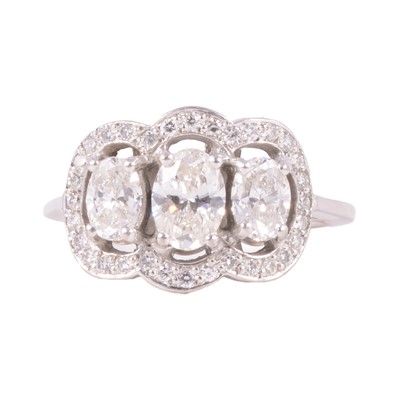 Lot 80 - A diamond three stone ring.