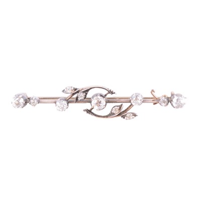 Lot 221 - A diamond bar brooch.