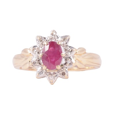 Lot 49 - A ruby and diamond cluster ring.