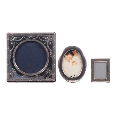 Lot 328 - Silver-mounted photograph frame, Keyford Frames Ltd, London 1990, and two small metal frames.