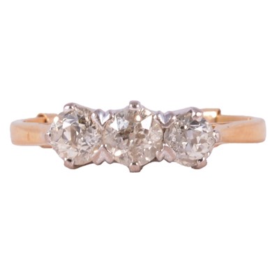 Lot 82 - A diamond three stone ring.