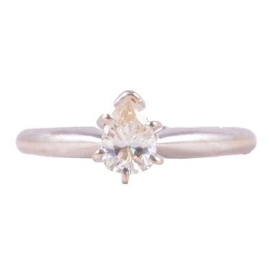 Lot 74 - A diamond solitaire ring.