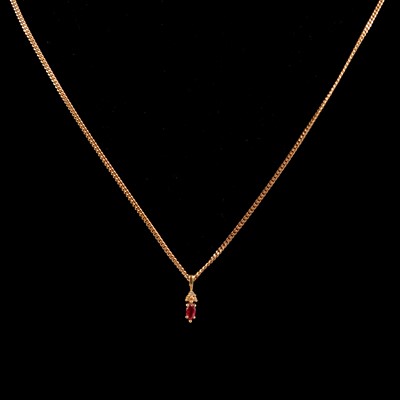 Lot 261 - A modern ruby and diamond pendant on a chain.
