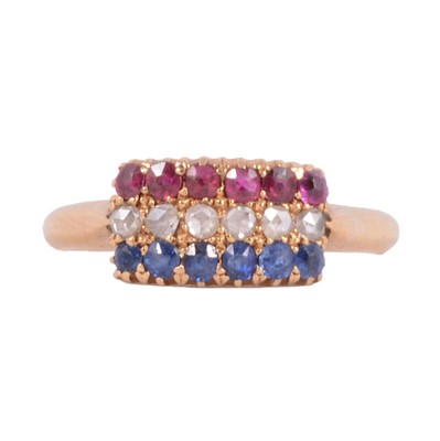 Lot 44 - A ruby, sapphire and diamond three row ring.