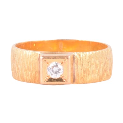 Lot 112 - A 22 carat gold wedding band with mounted diamond.