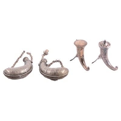 Lot 304 - Two Norwegian sterling pepperettes, horn form, and two white metal small powder flasks