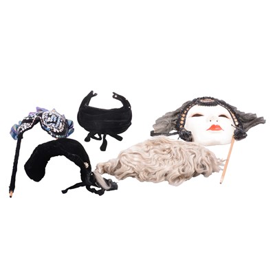 Lot 138 - Collection of theatrical masks, feathers, hats, and related framed display