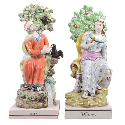 Lot 68 - Matched pair of Staffordshire earthenware figures, Widow of Zarephath and Elijah