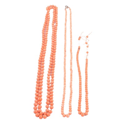 Lot 330 - A rope and two necklaces of coral beads.