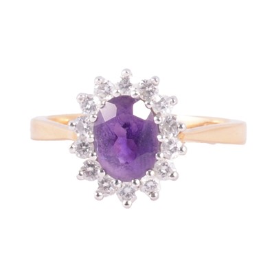 Lot 23 - An amethyst and diamond cluster ring.