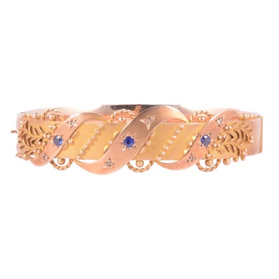 Lot 207 - A blue paste and diamond chip half-hinged bangle.