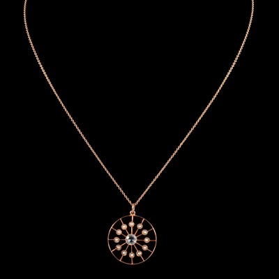 Lot 273 - An aquamarine and seed pearl pendant on a chain.