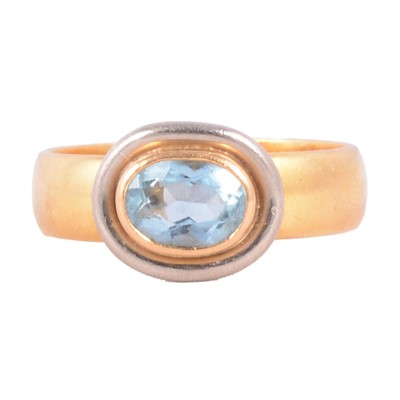 Lot 20 - A 22 carat gold wedding band with mounted aquamarine.
