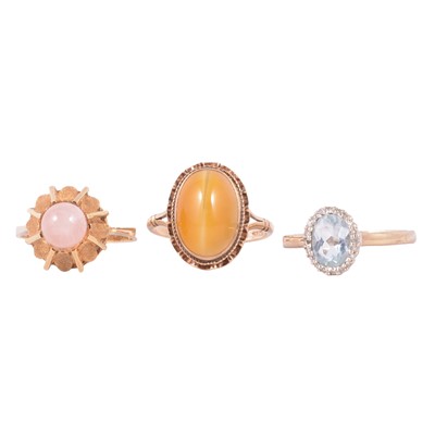 Lot 45 - Three gemset rings, rose quartz, cat's eye chrysoberyl, pale blue stone and diamond.