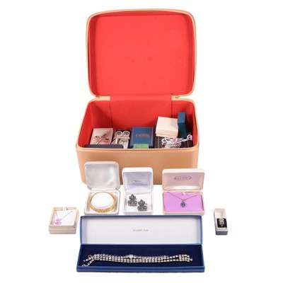Lot 498 - A collection of white metal and costume jewellery in a large Estée Lauder make-up case.