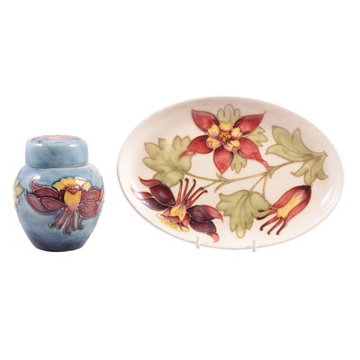 Lot 6 - Walter Moorcroft, a ginger jar and oval plate in the Columbine design.