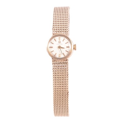 Lot 442 - Omega - a lady's 9 carat yellow gold manual wind bracelet wristwatch.