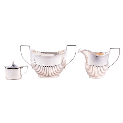 Lot 314 - A silver milk/cream jug, large sugar bowl and mustard pot.
