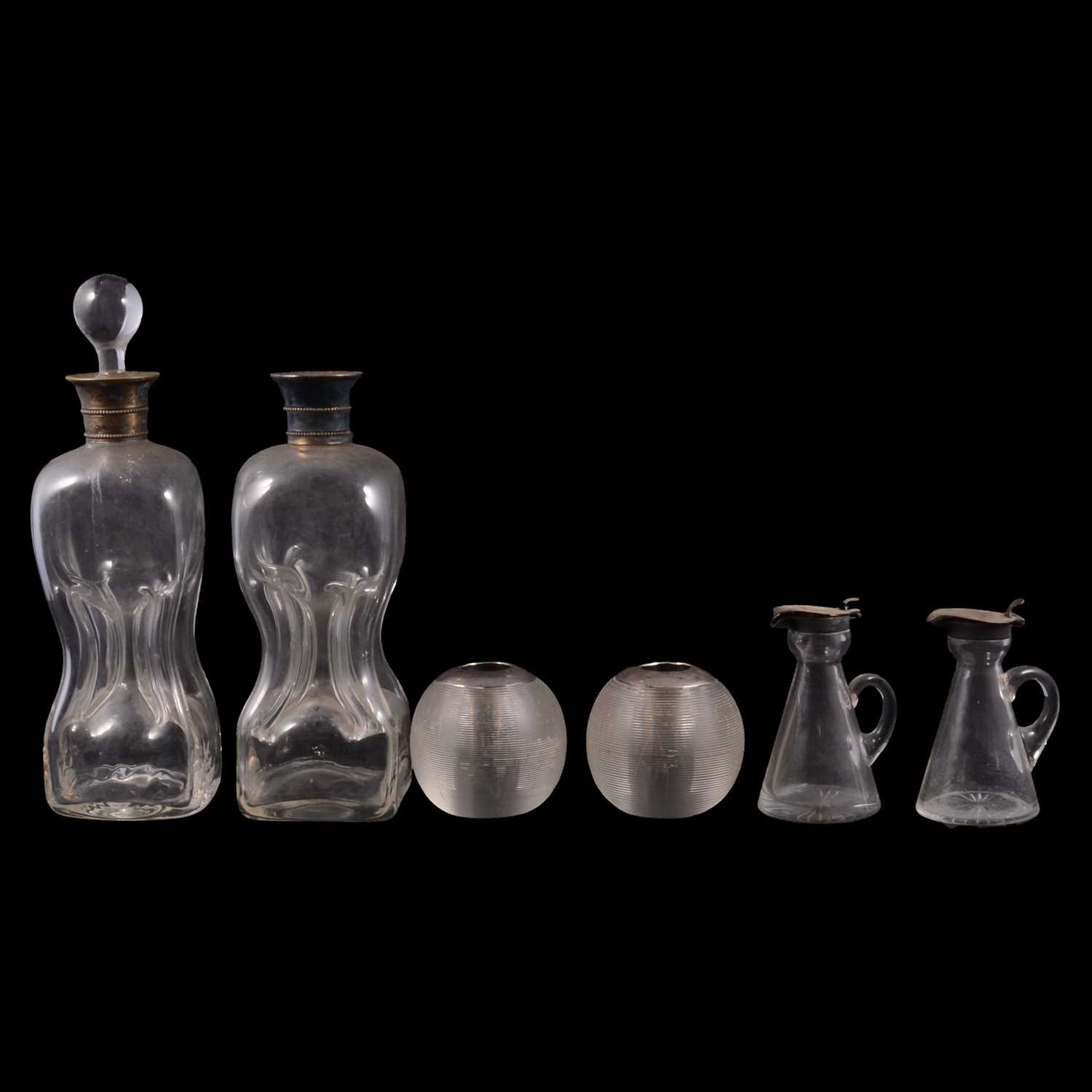 Lot 130 - Pair of silver mounted whisky noggins, two silver mounted match strikers and two decanters