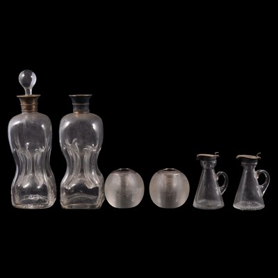 Lot 130 - Pair of silver mounted whisky noggins, two silver mounted match strikers and two decanters